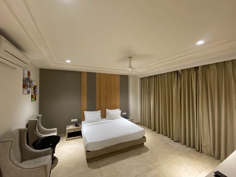 Hotel Maplewood Premier Premium AC room interior with king bed, split AC and the standard 280 to 320 square foot layout